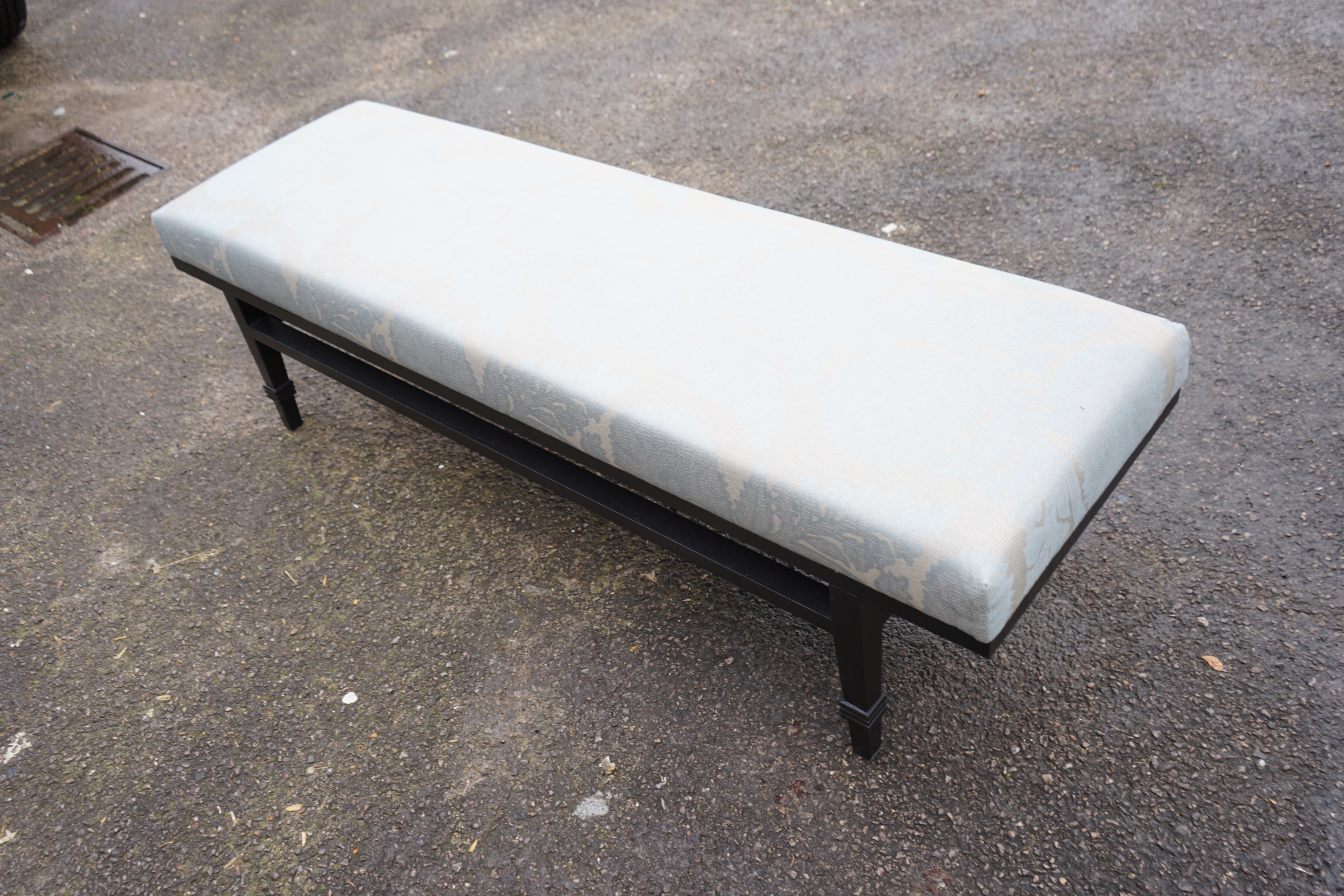 A Bray Design black walnut fireplace bench upholstered in Robert Allen Glamis Nile fabric, width 158cm, depth 46cm, height 44cm